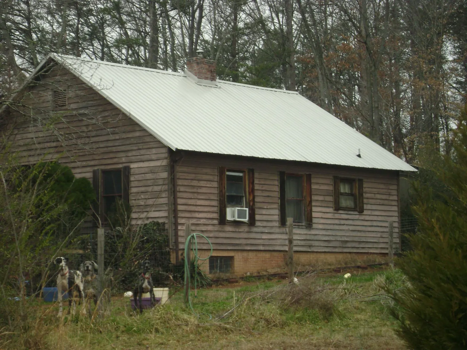 White metal roof on an old wood sided farmhouse, from a Metal Roof Installation job in Rindge